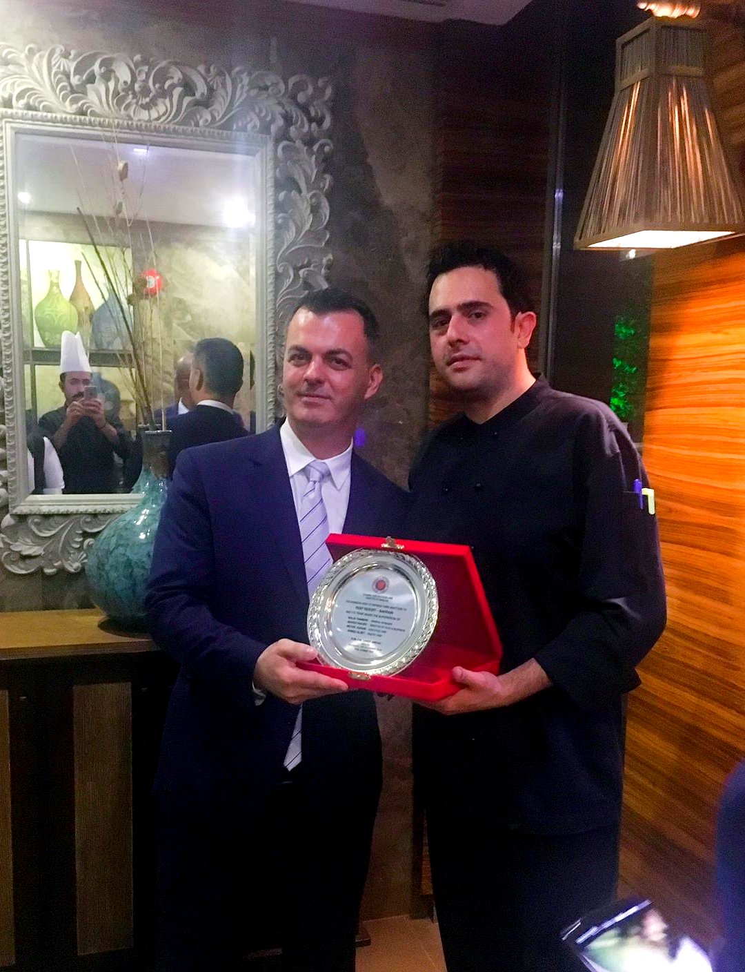 Michel Karam receiving recognition at an award ceremony