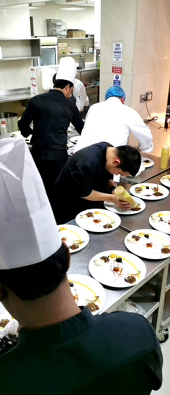 Kitchen plating team during live execution