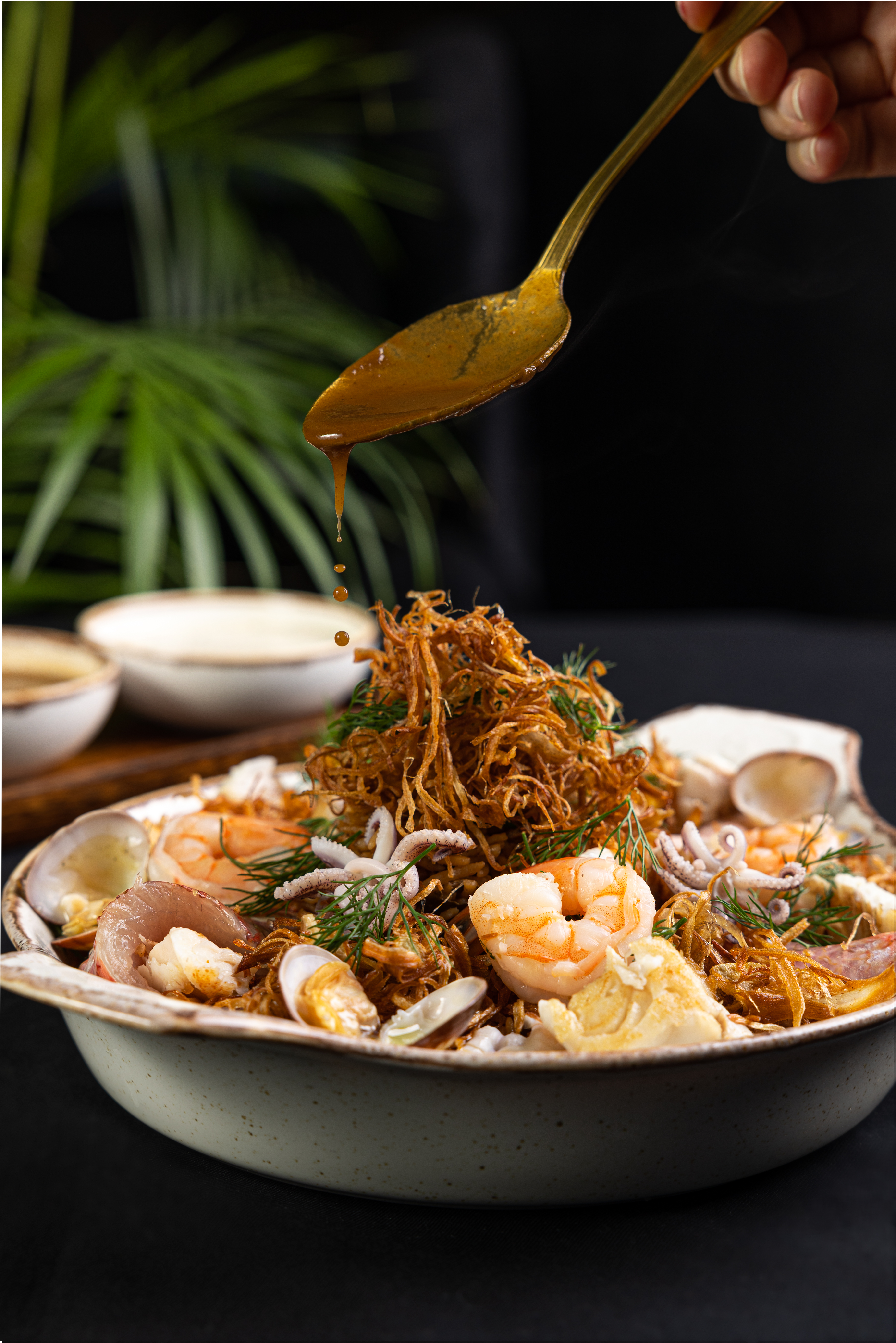 Michel Karam seafood plating with sauce action